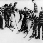 old photo of hockey players in striped outfits